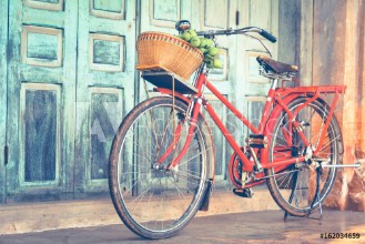 Image de Hipster red bicycle in old building walls background  color if vintage tone 